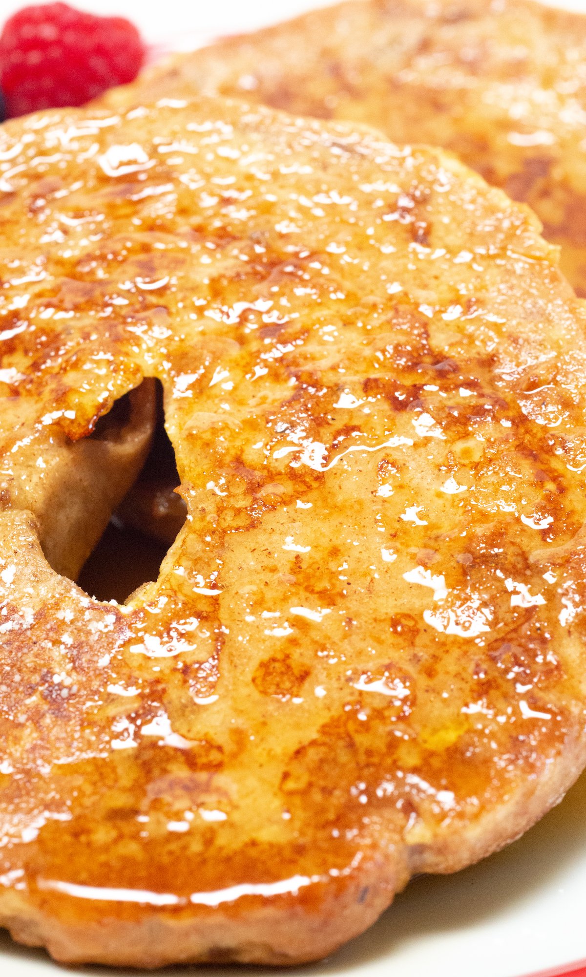 Close up of a french toast bagel that's been covered in syrup.
