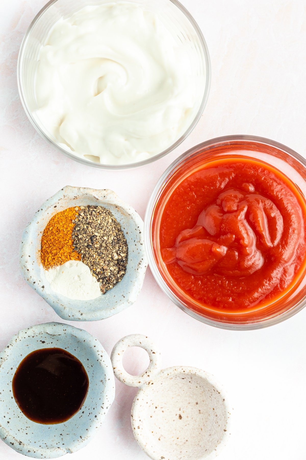 Overhead view of prep bowls filled with Zax sauce ingredients.