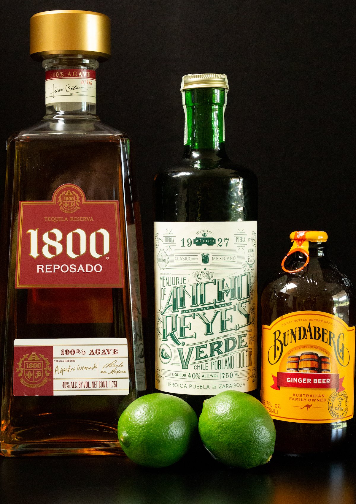 The ingredients for Mexican Mules on a black background.