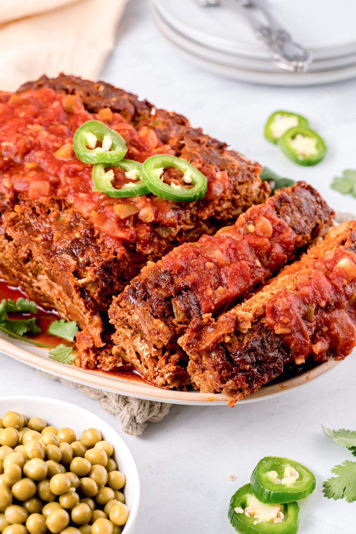 Sliced Mexican meatloaf on a serving dish. 