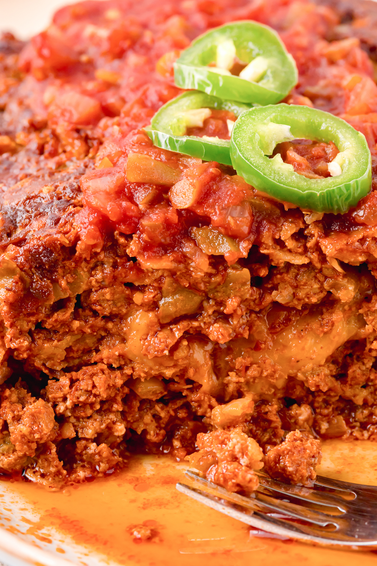 Close up of a Mexican Meatloaf that's been sliced to show the cheesy center.