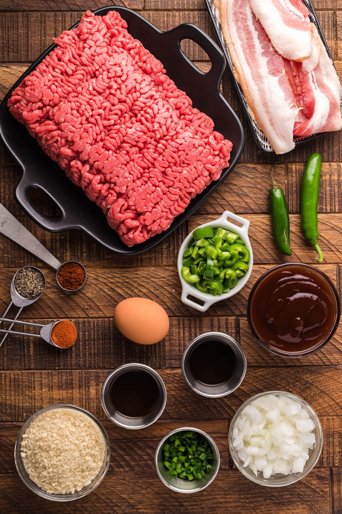 Overhead view of BBQ meatloaf ingredients in prep bowls. 