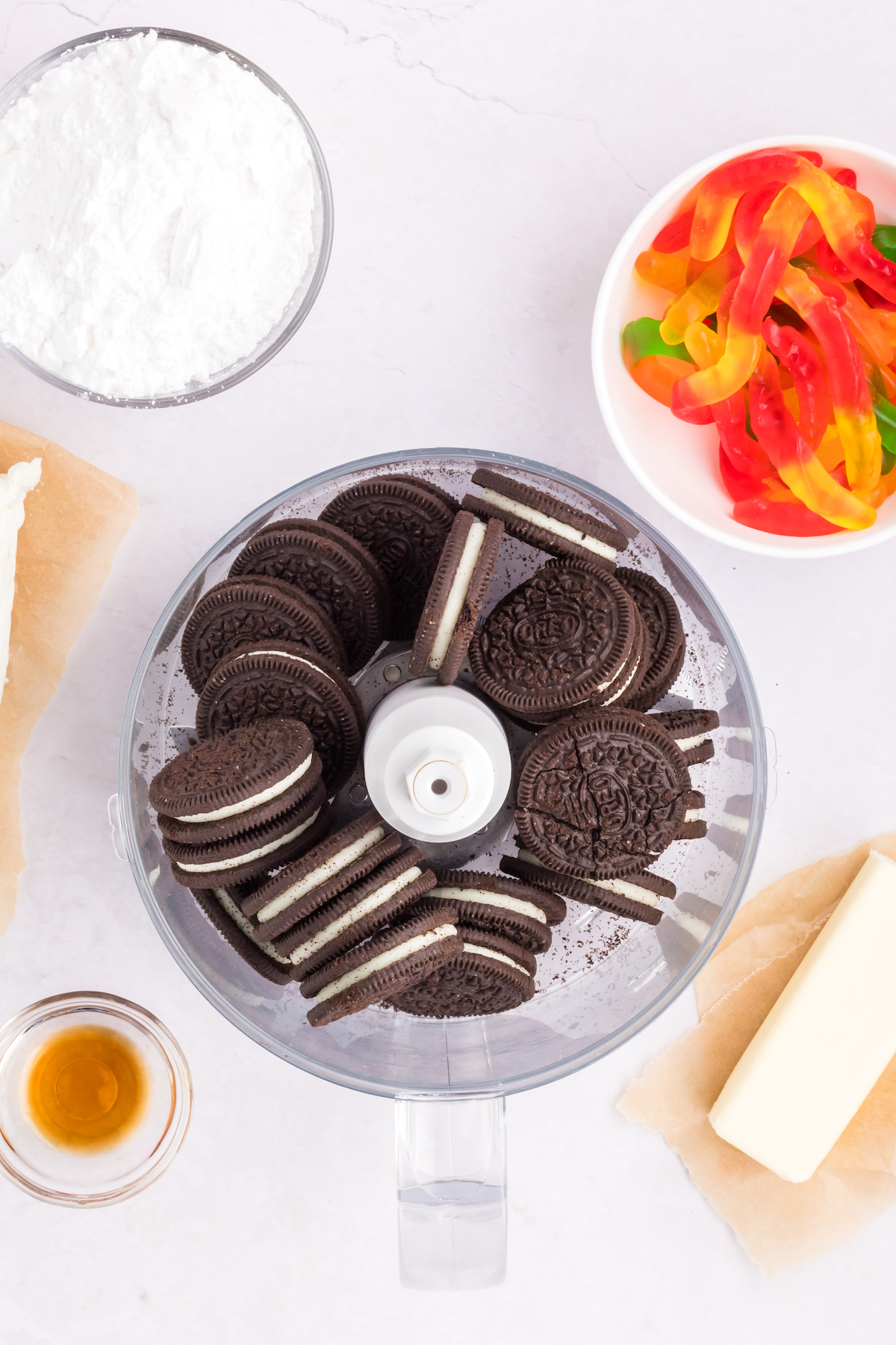 A food processor is filled with Oreo cookies. 
