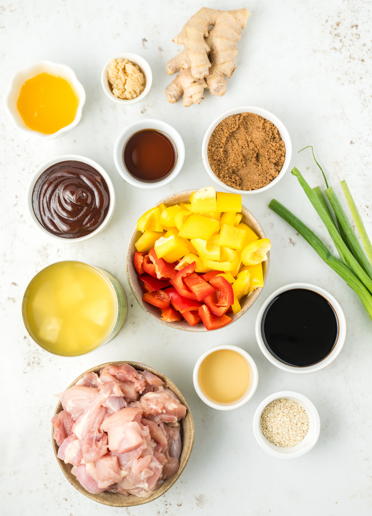 All the ingredients needed to make Hawaiian chicken set out in prep bowls.